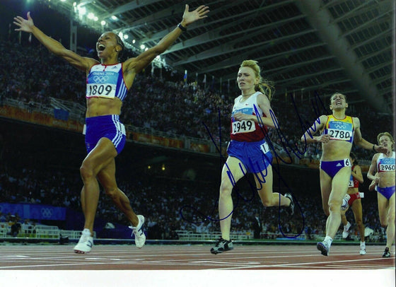 DAME KELLY HOLMES GENUINE HAND SIGNED 12X8 PHOTO ATHENS 2004 OLYMPICS
